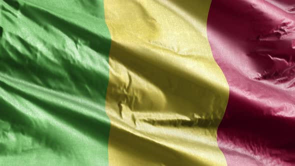 Mali textile flag waving on the wind. Slow motion. 20 seconds loop.