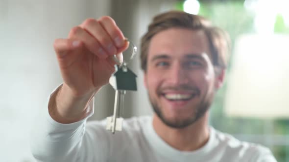 Housewarming Happy Man in a New Apartment the Male Smiles and Shows the Keys to the New Apartment to