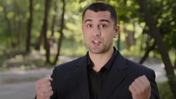 Portrait Outdoors Confident Caucasian Arabic Business Man Coach Teacher in Formal Black Suit Talk at