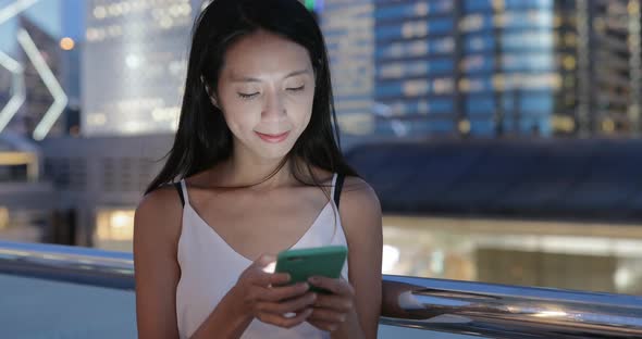 Woman use of smart phone in the city