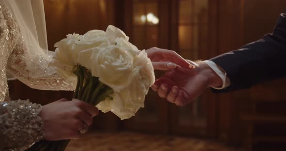 The Groom Extends His Hand To The Bride