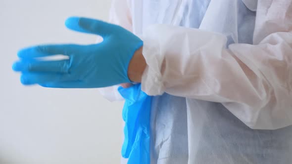 Closeup of Putting on Surgical Gloves