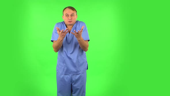 Displeased Man Indignantly Talking To Someone, Looking at the Camera. Green Screen