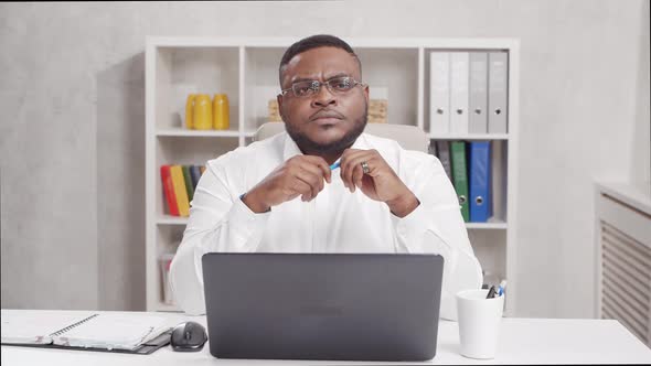 Workplace of freelance worker at home office. Young African-American man.