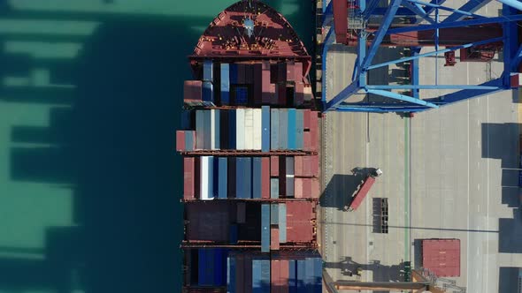 Aerial View. Container Ship Loading and Unloading in Deep Sea Port.