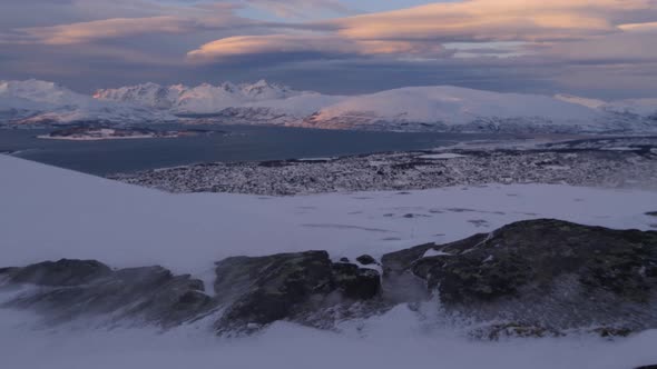 Tromso city seen from Storsteinen mount in high wind, Norway, Arctic