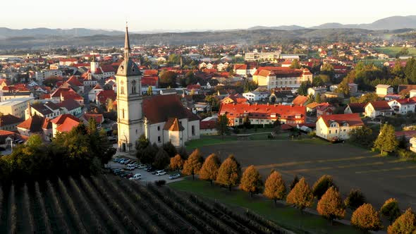 Aerial Panorama view of small medieval european town Slovenska Bistrica, Slovenia with church and ca