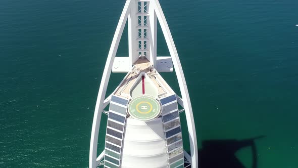 Aerial view of the top of luxurious Burj Al Arab Hotel in the bay of Dubai.