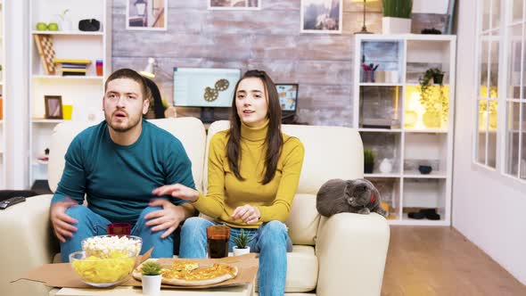 Disappointed Couple After Their Favorite Football Team Lost the Game