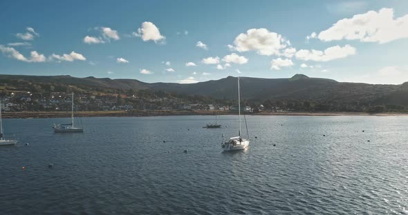 Regatta on Luxury Yachts Aerial. Sail Boats Cruise at Ocean Bay in Brodick Harbor, Scotland, Europe alt