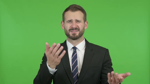 Ambitious Businessman Getting Upset Against Chroma Key