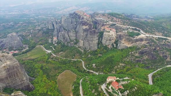 Aerial view of nature and landscape around rocky meteora monastery complex