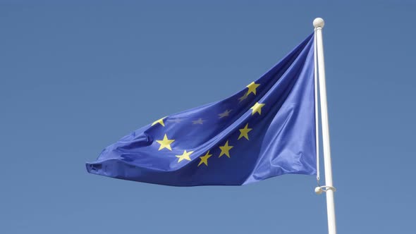 Flag of European Union waving in front of blue sky 4K 2160p 30fps UHD footage - Recognizable EU fede