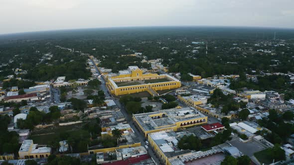 Aerial flying over Izamal, Mexico during early evening. Drone 4k