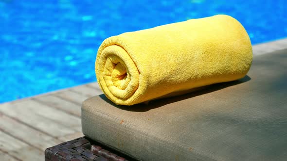 Towel on bed around swimming pool