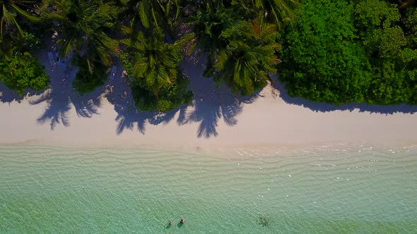 Wide angle texture of tropical seashore beach time by water with sand background in sunlight