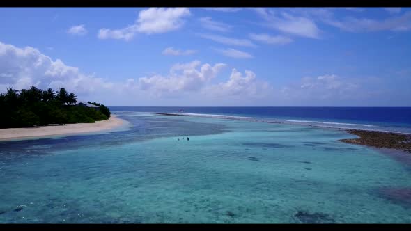 Aerial drone scenery of tropical tourist beach voyage by clear lagoon and clean sand background of a