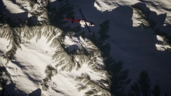 Helicopter Above Mountains in Snow