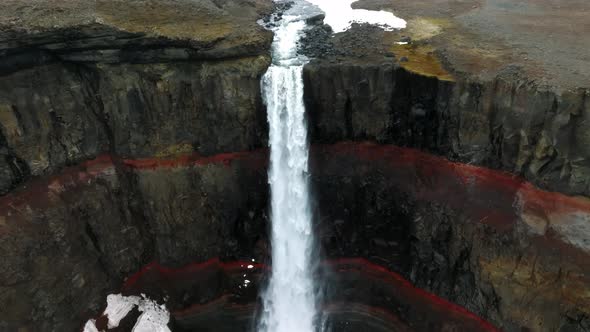 Aerial View on Hengifoss Waterfall with Red Stripes Sediments