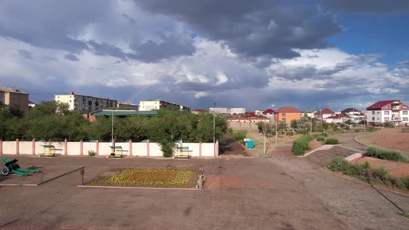 Bright Rainbow and Rain Over the City of Balkhash