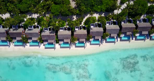 Luxury drone abstract shot of a summer white paradise sand beach and blue ocean background in vibrant