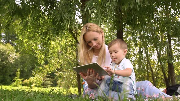 Woman and Child Using Tablet Computer