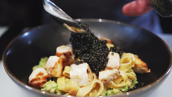 footage of dish with black caviar