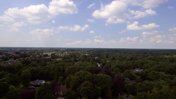 A drone flight over the Kempen forest and village in Belgium near to Antwerp. A drone flight over a