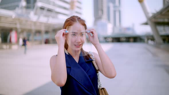 Office Girl in the city (Bangkok), wearing face shield