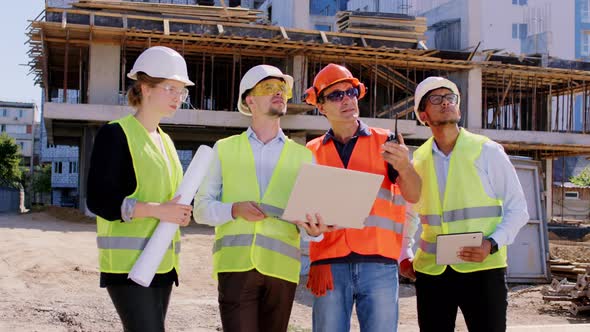 Group of Diverse Specialists at Construction Site
