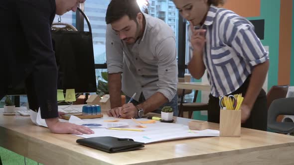 Creative Business People Group Having Conversation at Office Desk in Workplace