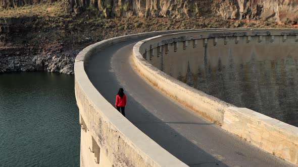 Asian woman hiking near the Salmon Falls Dam in Southern Idaho