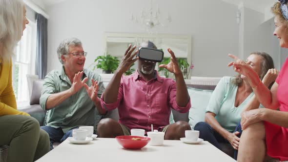Animation of diverse female and male senior friends using vr headset and having fun