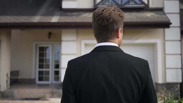 Live Camera Follows Successful Elegant Businessman Walking to House on Sunny Day Outdoors