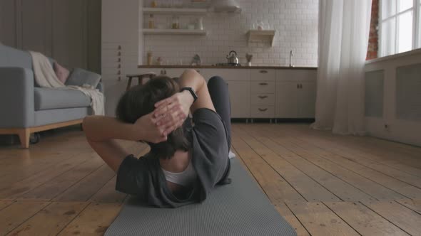 Young Woman Doing Core Workout