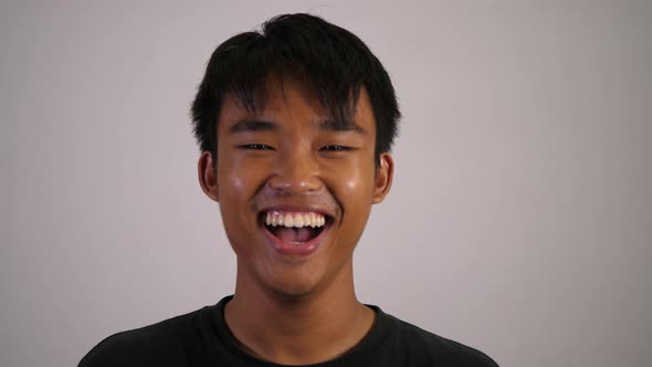 Asian teen man with big smile