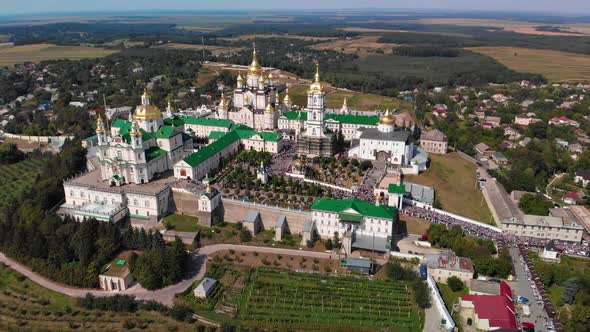 Top view of the Pochaev Lavra at the moment when a lot of people enter it.