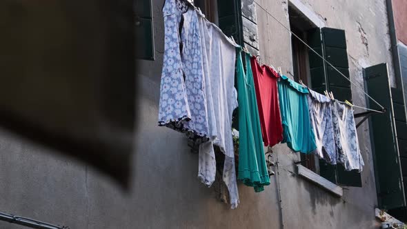 Laundry Dries on a Line Outside an Old Building on Venice Street Italy