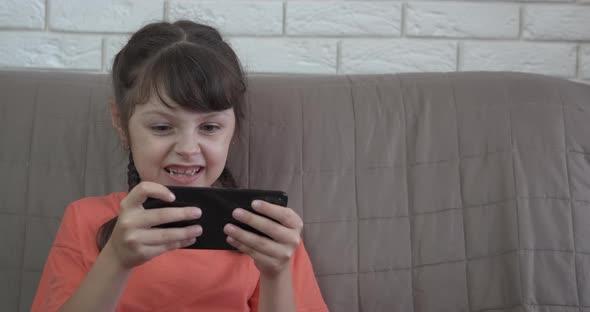 Child Enjoy Online Game at Home