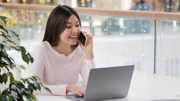 Happy Asian Korean Woman Freelancer Student Businesswoman Holding Mobile Phone Call Working with