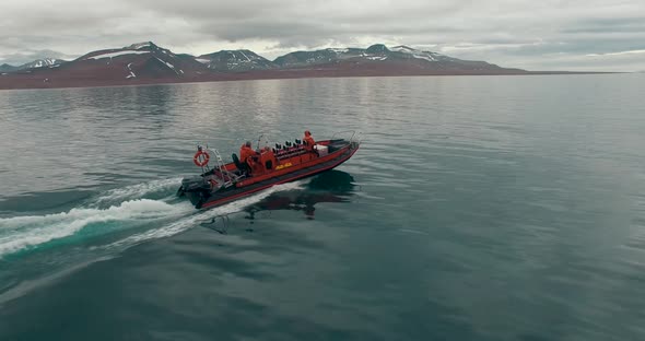 Beautiful View of the Arctic Ocean Area at the Coast of Svalbard with a Speedboat Moving Forward