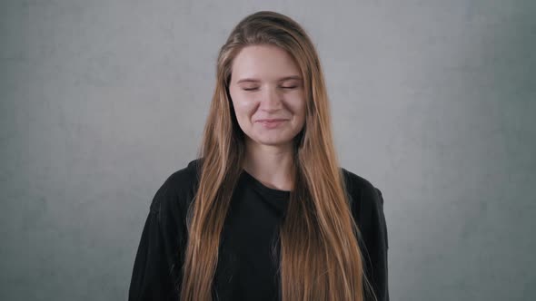 Young Woman Crying Looking at the Camera