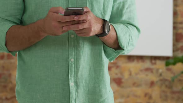 Caucasian man using his phone