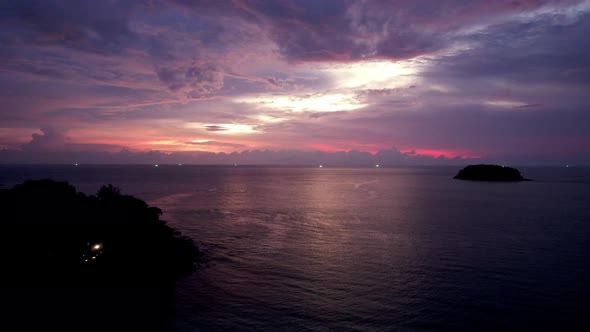 Purple Sunset with a View of the Sea and Clouds