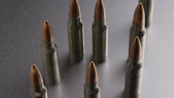 Cinematic rotating shot of bullets on a metallic surface - BULLETS 004