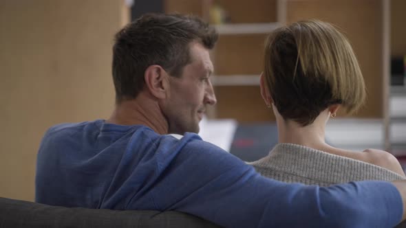 Back View Man Trying to Hug Woman As Lady Shaking Off Hand