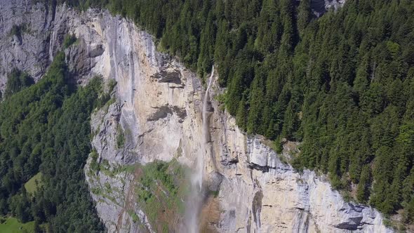 Aerial travel drone view of the Lauterbrunnen Valley and Staubbach Falls, Switzerland.