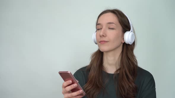 Portrait of Attractive Cheerful Woman Listening Single Hit Using Device