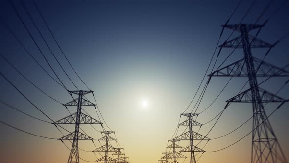 Endless electric powerlines and pylons loopable animation on an evening sky. HD