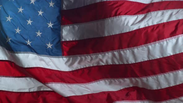 Slow motion shot of United States of America flag waving in wind alt